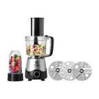 Vista frontal del sistema de cocina Magic Bullet Kitchen Express 3-en-1 mostrando su base de motor con verduras picadas en el tazón de procesamiento, frutas en el vaso de licuadora y tres discos de corte de acero inoxidable - Almacén La Palma - 1690009