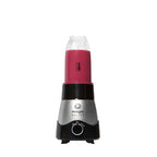 Vista frontal de la base de motor del sistema de cocina Magic Bullet Kitchen Express 3-en-1 ensamblada con su vaso de licuadora conteniendo un batido de frutos del bosque - Almacén La Palma - 1690009