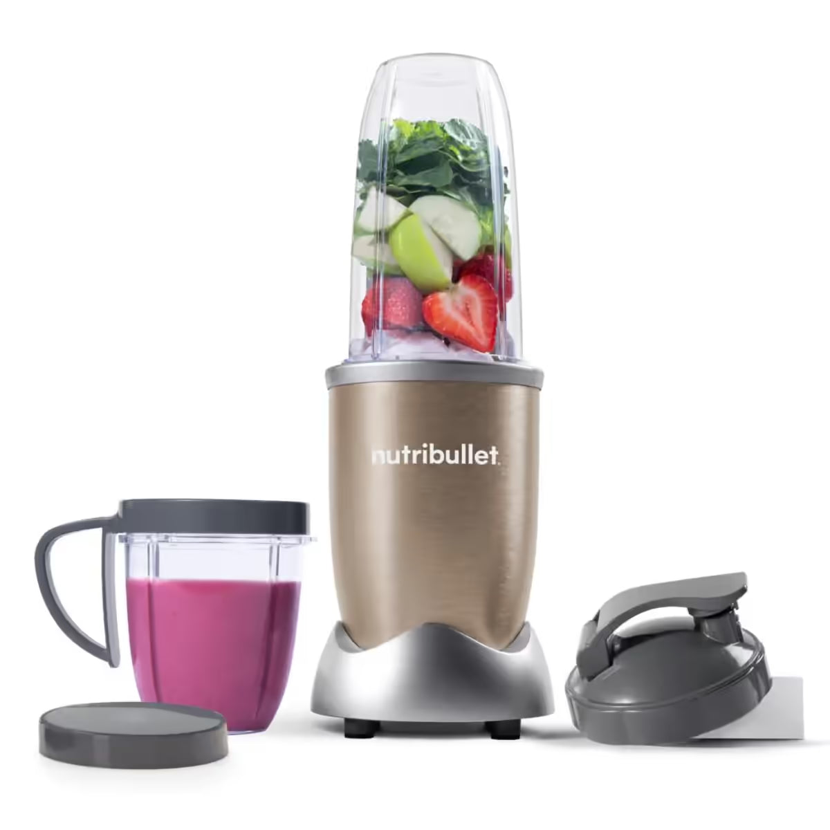 Licuadora personal Nutribullet Pro 900W en color champagne con frutas y verduras en el vaso principal y batido rosa preparado en el vaso secundario - Ferretería La Palma - 1690013