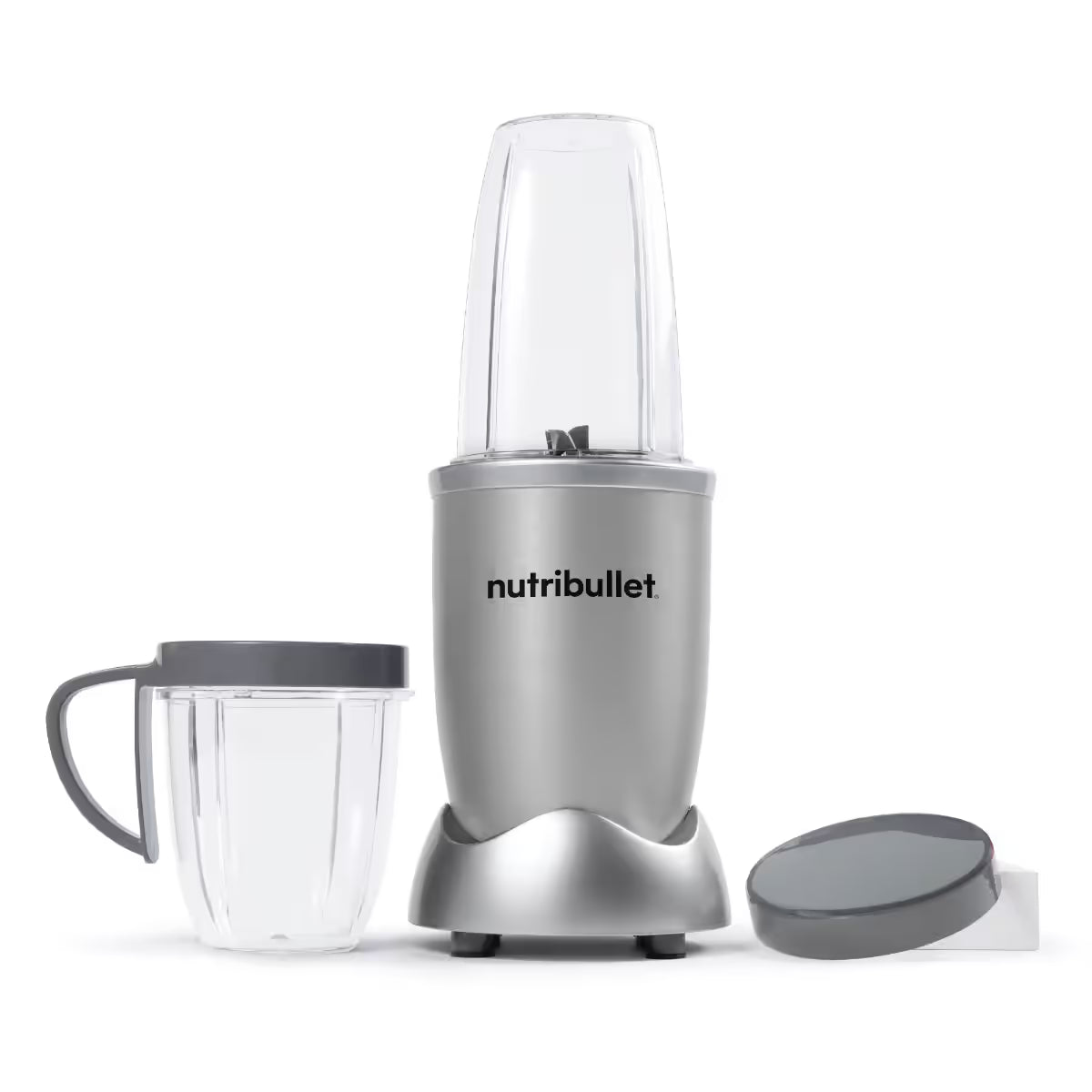 Licuadora personal Nutribullet Original 600W en color plateado mostrando los vasos y la tapa vacíos sobre fondo blanco - Ferretería La Palma - 1690080