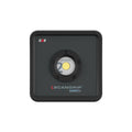 Vista frontal del reflector LED compacto industrial Scangrip NOVA 2 CONNECT mostrando su lente central COB sobre fondo blanco - Ferretería La Palma - 1870008