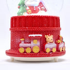 Primer plano de la base con tren y vagones con regalos de la bola de nieve  navideña Starlights Santa Claus - Ferretería La Palma - 1800000